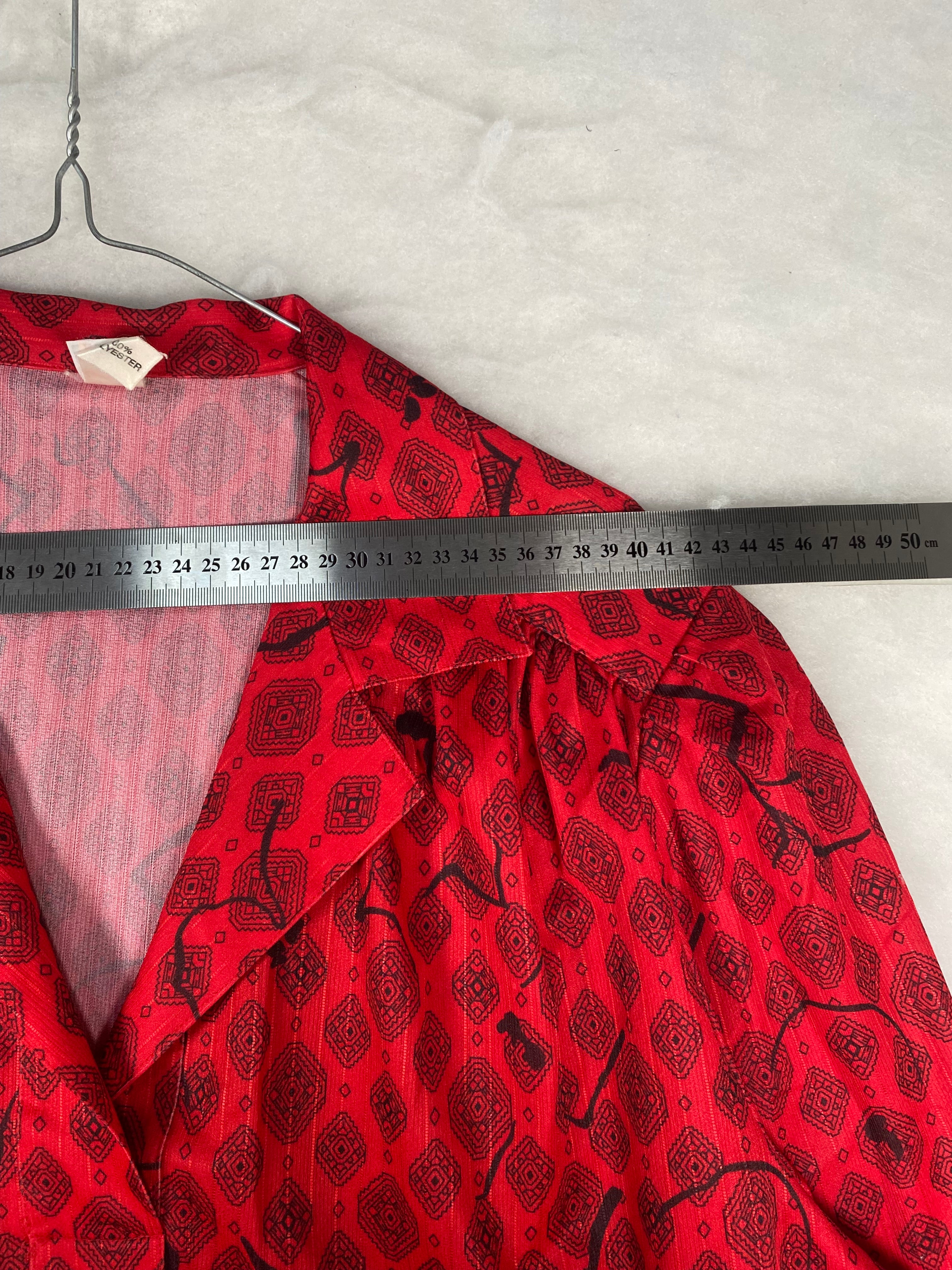 Blusa rossa stampa foulard - etichetta composizione