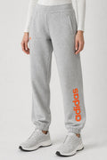 Pantaloni tuta Adidas grigi con logo arancione – Donna Taglia S