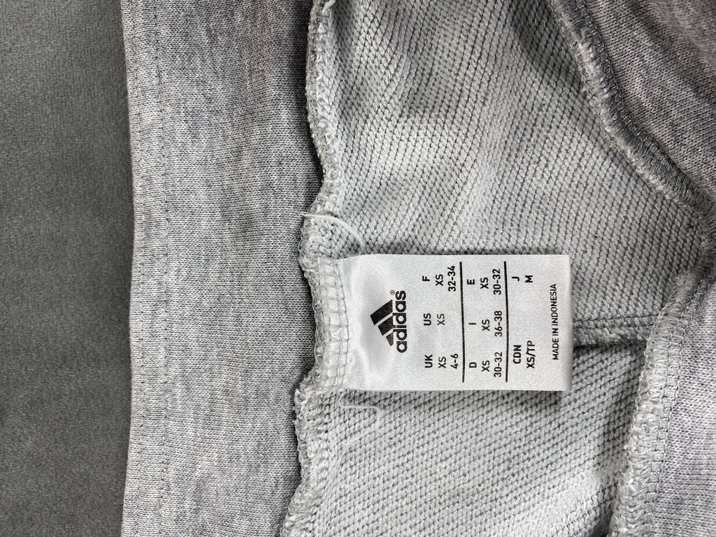 Pantaloni tuta Adidas grigi con logo arancione – Donna Taglia S